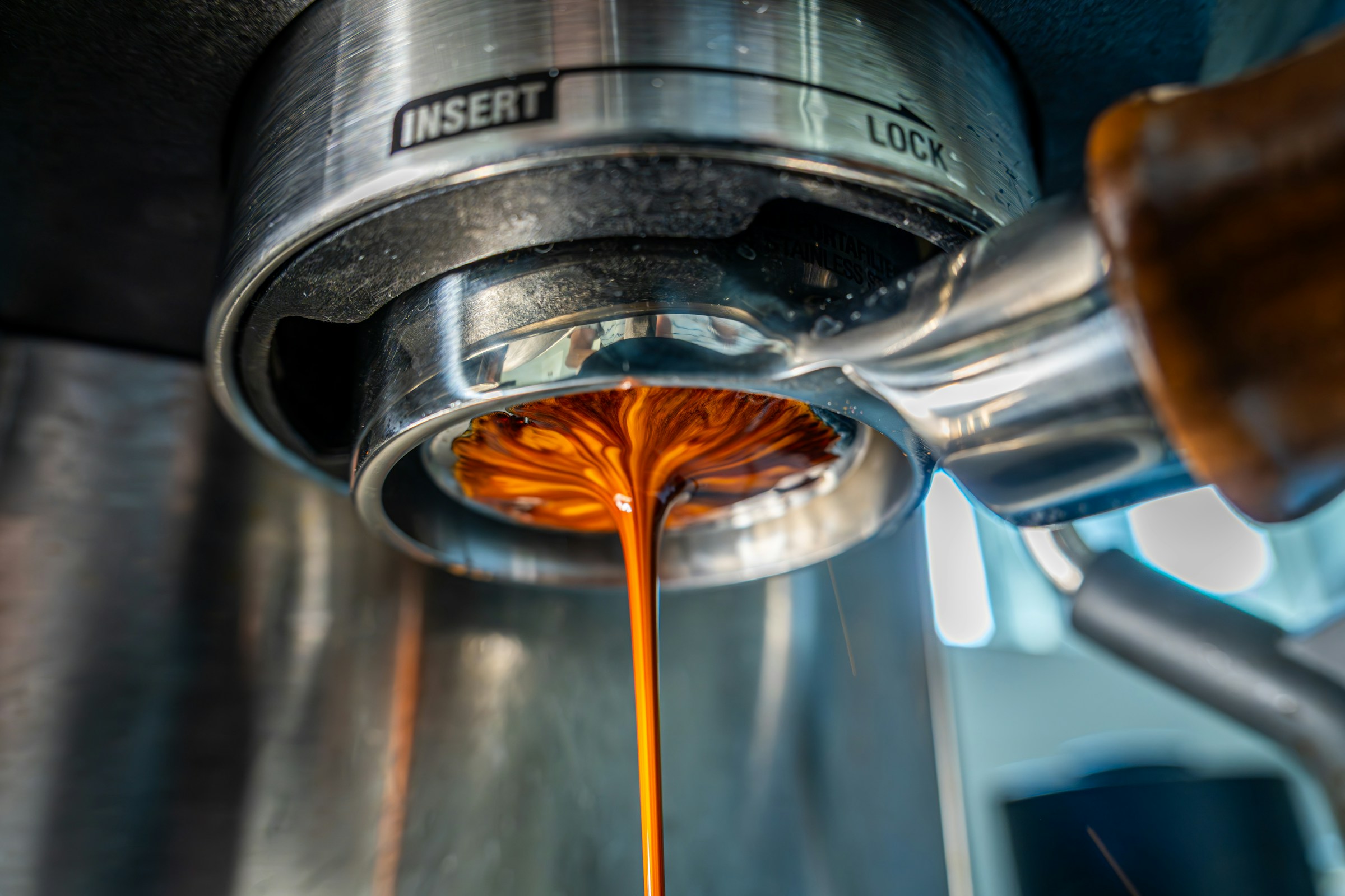 A fresh shot of espresso pulling from a bottomless portafilter